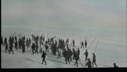 Image of Many sealers setting out across snow